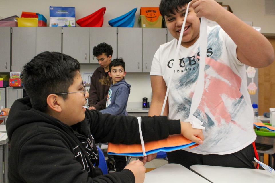 Students practice their splint wrapping techniques.