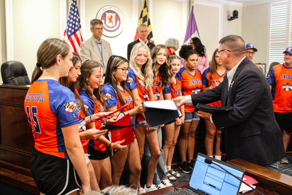Council Member Dave Stepp hands out Certificate of Recognition to the girls softball team.