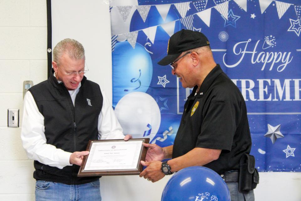 Lt.Williams accepts a Certificate of Recognition for Council President Chuck Callahan.
