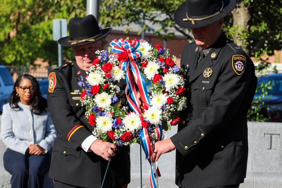 Easton Chief of Police Alan Lowrey (left) and Talbot County Sheriff Joe Gamble (right) present the wreath, honoring lives lost on September 11, 2001 and aftermath.