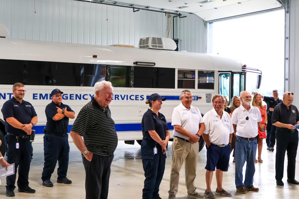 DES Staff, Contractor Richard S. Davis, Talbot Paramedic Foundation members stand in front of the Talbot DES Emergency Response Bus, in the Bay garage area.