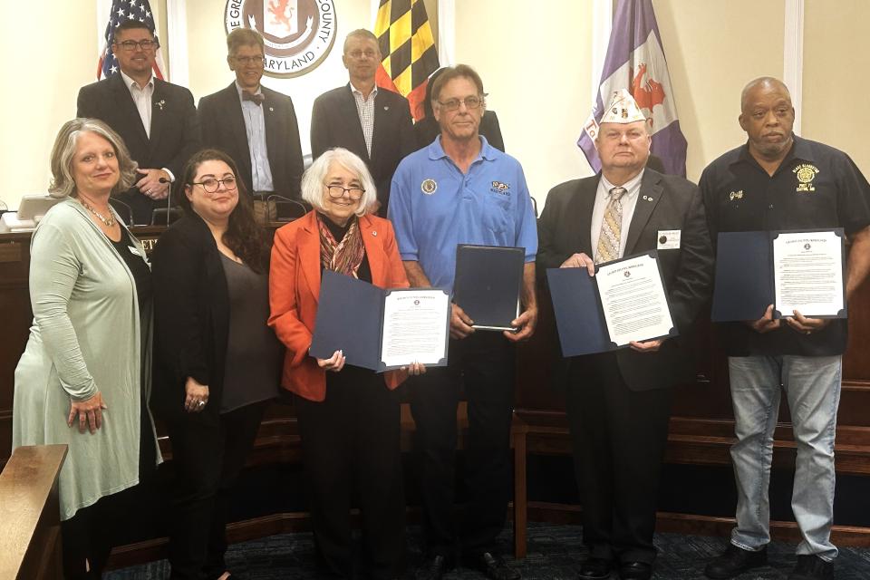 Council Member Lynn Mileke present proclamation for Operation Green Light