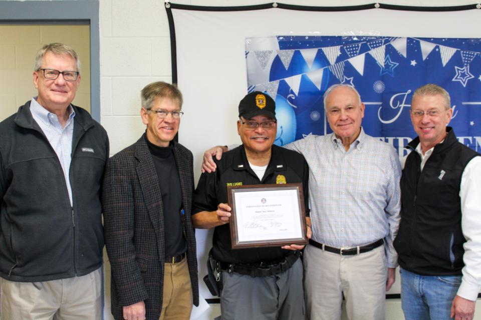Lieutenant Howard "Gary" Williams stands with County and Department of Corrections Leadership during his retirement celebration.