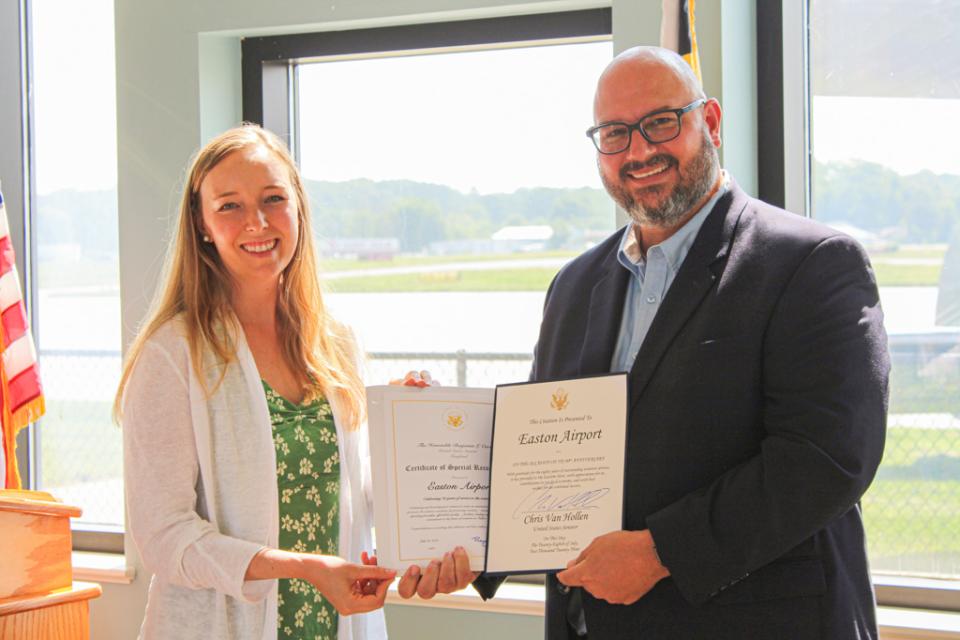 Alyssa Hastings, Eastern Shore Regional Coordinator for the Office of Senator Van Hollen, presents two citations on behalf of the congressional delegation.
