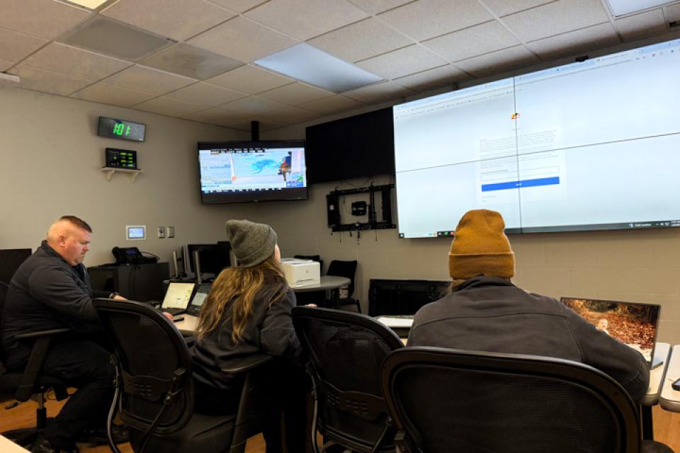 Emergency Services staff monitors storm conditions from the emergency operations center.