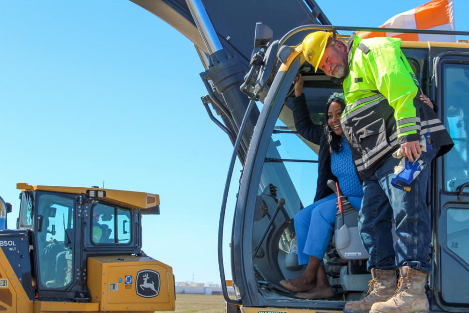 As.Secretary Greene checks out on the of the excavators, used for moving large piles of broken up concrete and materials from the construction site.
