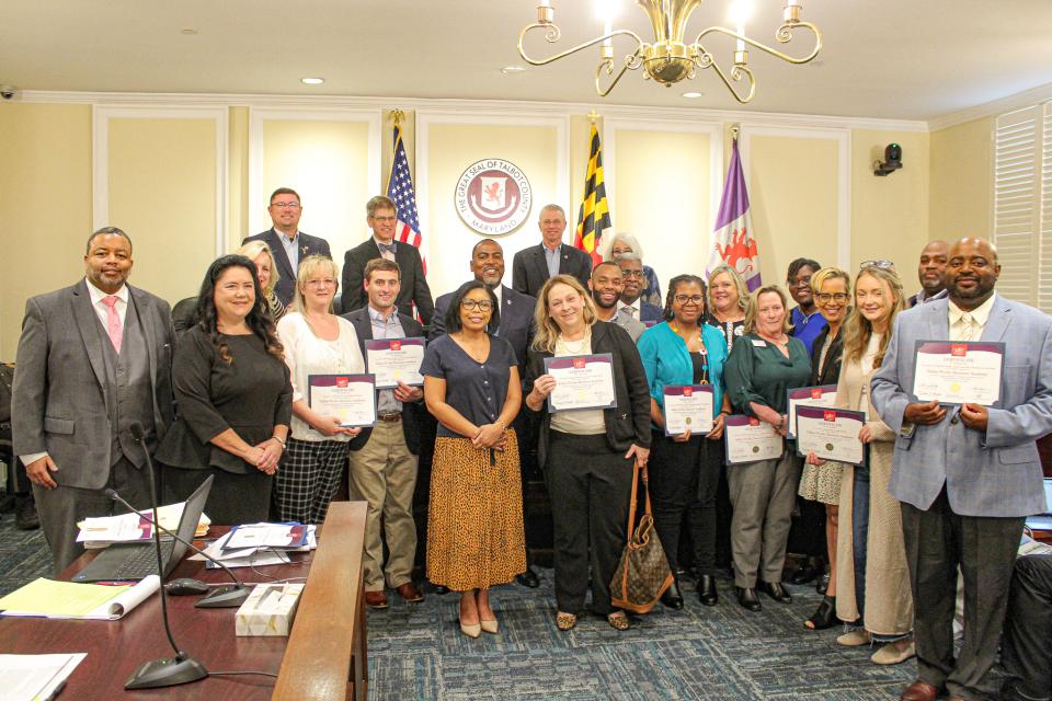 Council Member Keasha Haythe stands with graduates of the Talbot Works Business Academy. The first cohort had 15 business participants.