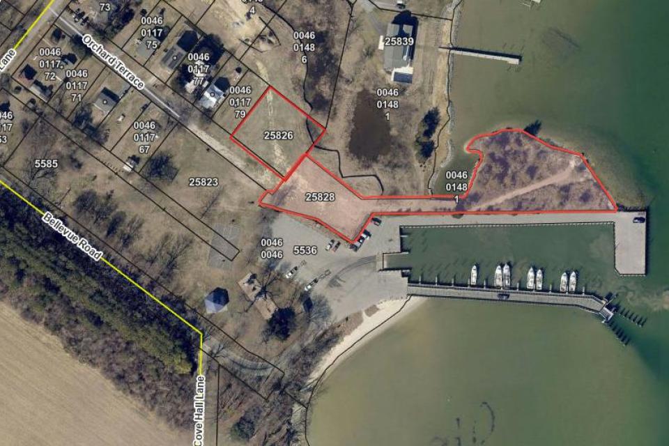 The property, located at 25826 Orchard Terrace, sits immediately adjacent to the existing park and public landing. Listed as addresses 25826 and 25828 on the map.