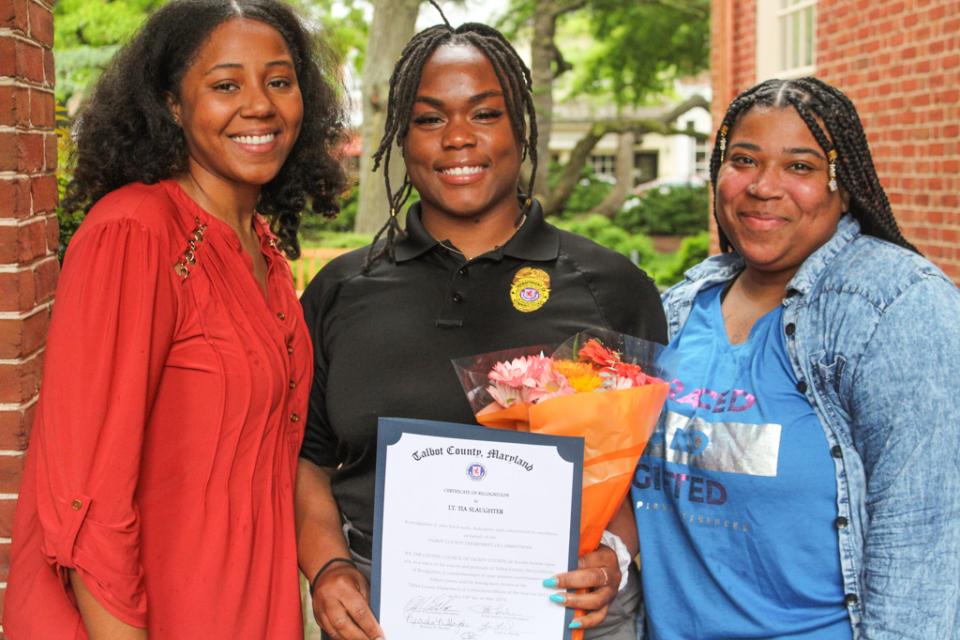 Lt. Tia Slaughter celebrates &quot;Officer of the Year&quot; recognition with family members.